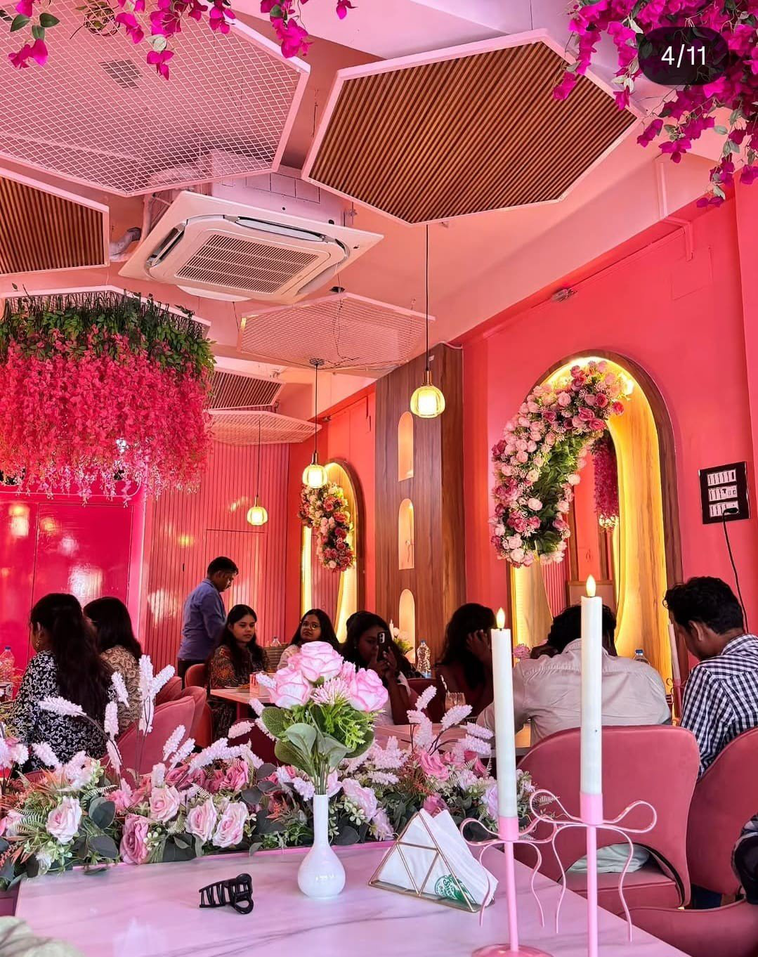 Families dining under floral arches at Bloomora